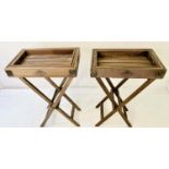 BUTLER TRAYS ON STANDS, a pair, each with a graduated set of three trays, 51.5cm x 33cm x 77cm at