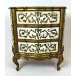 ITALIAN COMMODE, Florentine giltwood and parcel gilt, the shaped top above three drawers raised on