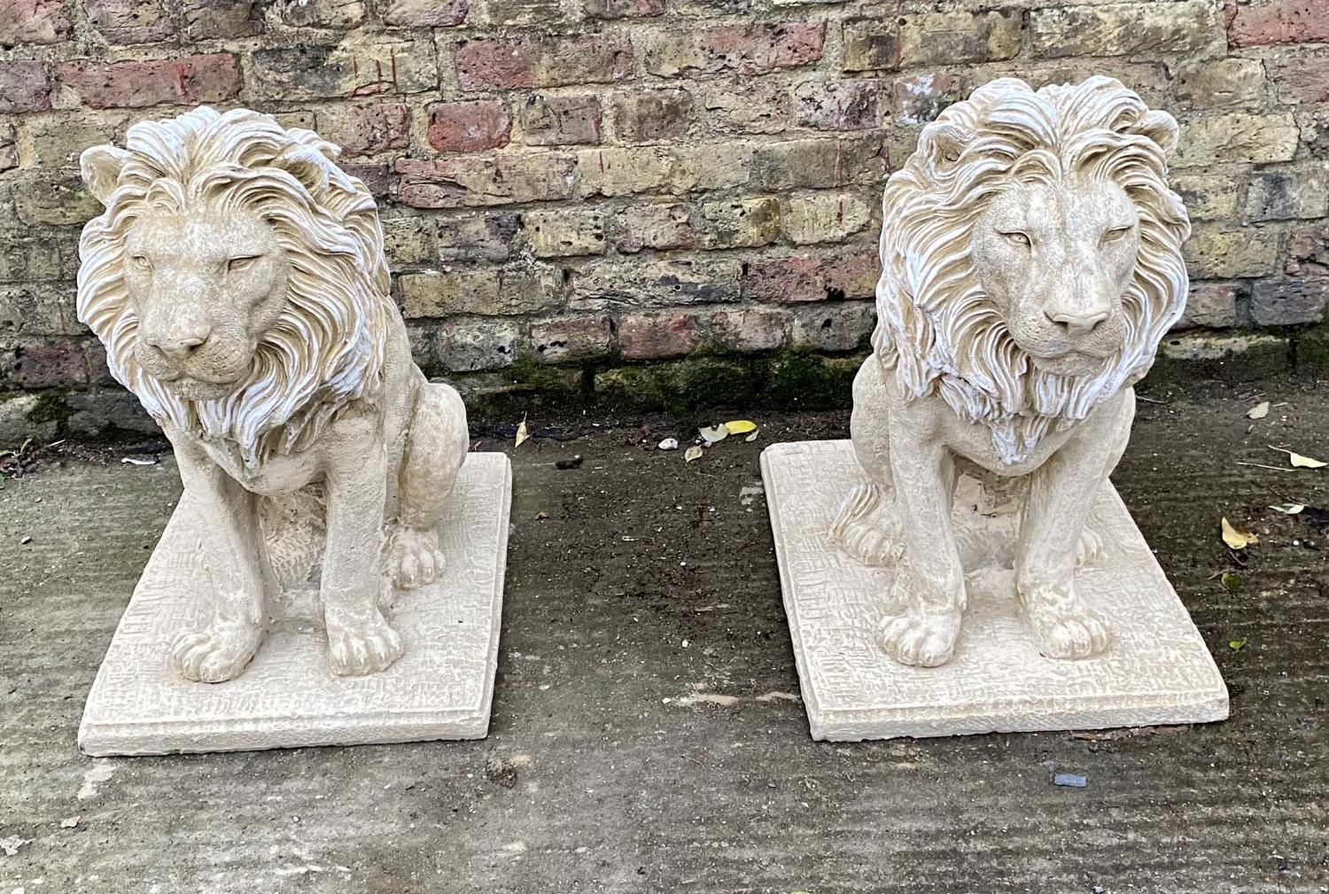 SCULPTURAL LIONS, a pair, 70cm H, composite stone. (2)