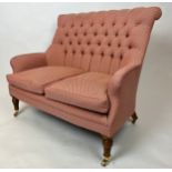 SOFA, Victorian design buttoned back upholstered with turned supports and castors, 118cm W x 95cm