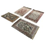HEREKE SILK RUGS, a collection of four, largest 124cm x 81cm.