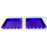 COCKTAILS TRAYS, a pair, 7cm high, 70cm wide, 53cm, electric blue mirrored glass, cabouchon