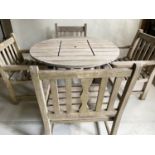 GARDEN TABLE AND ARMCHAIRS, weathered teak circular slatted together with four armchairs (two by