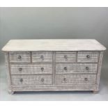 LOW CHEST, cane panelled with eight drawers and silvered knobs, 153cm x 46cm x 78cm H.