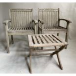 GARDEN ARMCHAIRS, a pair, nicely weathered slatted teak with curved arms and a low X frame table