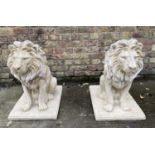 SCULPTURAL LIONS, a pair, 70cm H, composite stone. (2)