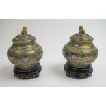 CLOISONNE LIDDED VASES, a pair, 20th century, in green, blue and pinik enamels, the lids adorned