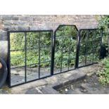 ARCHITECTURAL GARDEN MIRRORS, a pair and one other, 90cm x 90cm at largest, black metal frames. (2)