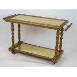 DRINKS TROLLEY, 71cm H x 117cm x 43cm, mid 20th century beechwood with two inset brushed brass