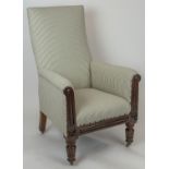 LIBRARY ARMCHAIR, 110cm H x 70cm, William IV mahogany in ticking on brass castors.