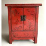 CABINET, early 20th century Chinese scarlet lacquered and gilt decorated with two panel doors,