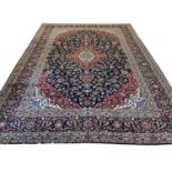 FINE PERSIAN KASHAN CARPET, 395cm x 298cm.