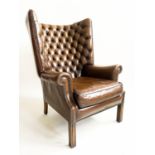 WING ARMCHAIR, George III design, mahogany with buttoned tan leather upholstery, 75cm W.