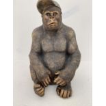 GORILLA WEARING A BASEBALL CAP, contemporary school sculpture, resin in bronzed finish, 58x40x34.