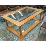 LOW TABLE, 120cm x 80cm x 47cm H. wood and glass with turned columns.