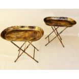 FOLD OUT TRAY TABLES, a pair, 40.5cm x 68cm x 66cm, aged gilt metal. (2)