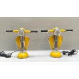 TABLE LAMPS, a pair, 41cm H, in the form of moped fronts, yellow finish. (2)