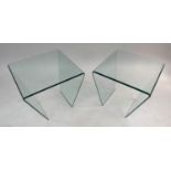 SIDE TABLES BY FENDI, a pair, polished and bevelled glass of trapezoid form, 50cm x 50cm x 50cm. (2)