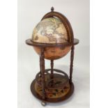 GLOBE COCKTAIL CABINET, in the form of an antique terrestrial globe with rising lid and fitted