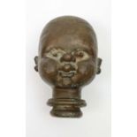 DOLL'S HEAD MOULD, French, early 20th century, cast metal.