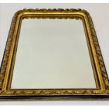 OVERMANTEL MIRROR, 19th century French giltwood having scroll detail with ebonised slip, 83cm W x
