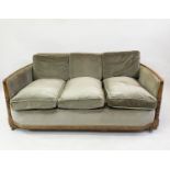 ART DECO SOFA, oak, with concave panelled back, carved front and green velvet upholstery, 156cm W.