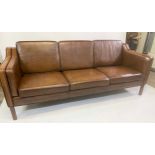 DANISH SOFA, 1970s raw grained sienna leather, with three seat cushions, 213cm W.