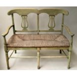 HALL BENCH, vintage green stained with raised lyre back and rush seat, 114cm W.