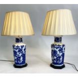 TABLE LAMPS, a pair, blue and white Chinese style ceramic of facetted vase form with pleated shades,