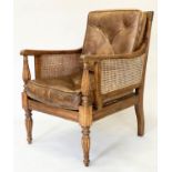 BERGERE, Regency design cane panelled with reeded supports and buttoned natural hide cushions,