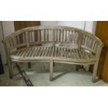 GARDEN BENCH, 85cm H x 160cm, weathered teak of banana form.