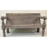 COLONIAL STYLE BENCH, antique stained scotch pine with close planked top and down swept carved and