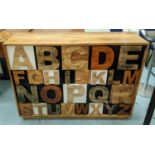 CABINET, 126cm x 40cm x 87cm H, with alphabet blocks detail.