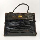 VINTAGE HERMÈS KELLY 35 NOIR SHINY CROCODILE BAG, stamped Hermès Paris 24 Fg St Honoré, gold