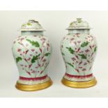 CHINESE LIDDED URNS, a pair, each 47cm H on gilt bases, with painted detail 'C11/2' to underside and