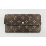 LOUIS VUITTON MONOGRAM WALLET, with a central zipped coin pocket, multiple card slots, two large