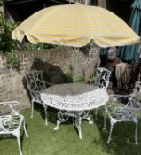 GARDEN SET, circular pierced cast aluminium with four matching armchairs and sun umbrella, table