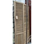 FLOOR STANDING LOUVERD SCREENS, a pair, 210.5cm x 45cm per panel. (2)