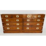 LOW CHEST, Campaign style yewwood and brass bound with nine drawers, 150cm x 43cm x 70cm H.