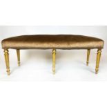 WINDOW SEAT, Regency style giltwood, upholstered in gold fabric, on turned legs, 124cm H x 39cm x