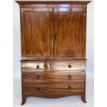 LINEN PRESS, Regency figured mahogany with two panelled doors enclosing trays above drawers and well