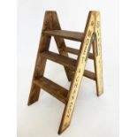 CHAMPAGNE STEPS, hinged A frame four tread with Champagne house insignias, 81cm H x 69cmx 44cm.