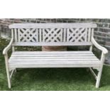 LATTICE GARDEN BENCH, well weathered teak with triple lattice panelled back and slatted seat,