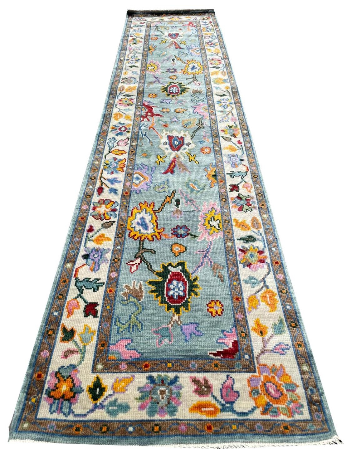 FINE CONTEMPORARY OUSHAK RUNNER, 335cm x 77cm.