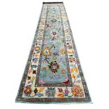 FINE CONTEMPORARY OUSHAK RUNNER, 335cm x 77cm.