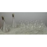 THOMAS GOODE SILVER CAPPED DECANTERS, 2006, a pair, ribbed cut glass, with twelve champagne glasses,
