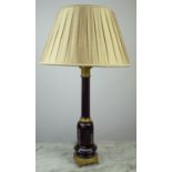 LAMP, Continental black glass with detailed engraved gilt metal mounts, on round base with paw feet,