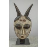 AN IGBO POST MASK, Nigeria. 70cm H