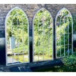 ARCHITECTURAL GARDEN MIRRORS, a set of three, aged metal frames, 160cm x 67cm. (3)