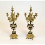 CANDELABRAS, a pair, Italian brevettato gilded metal seven branch with black marble and putto